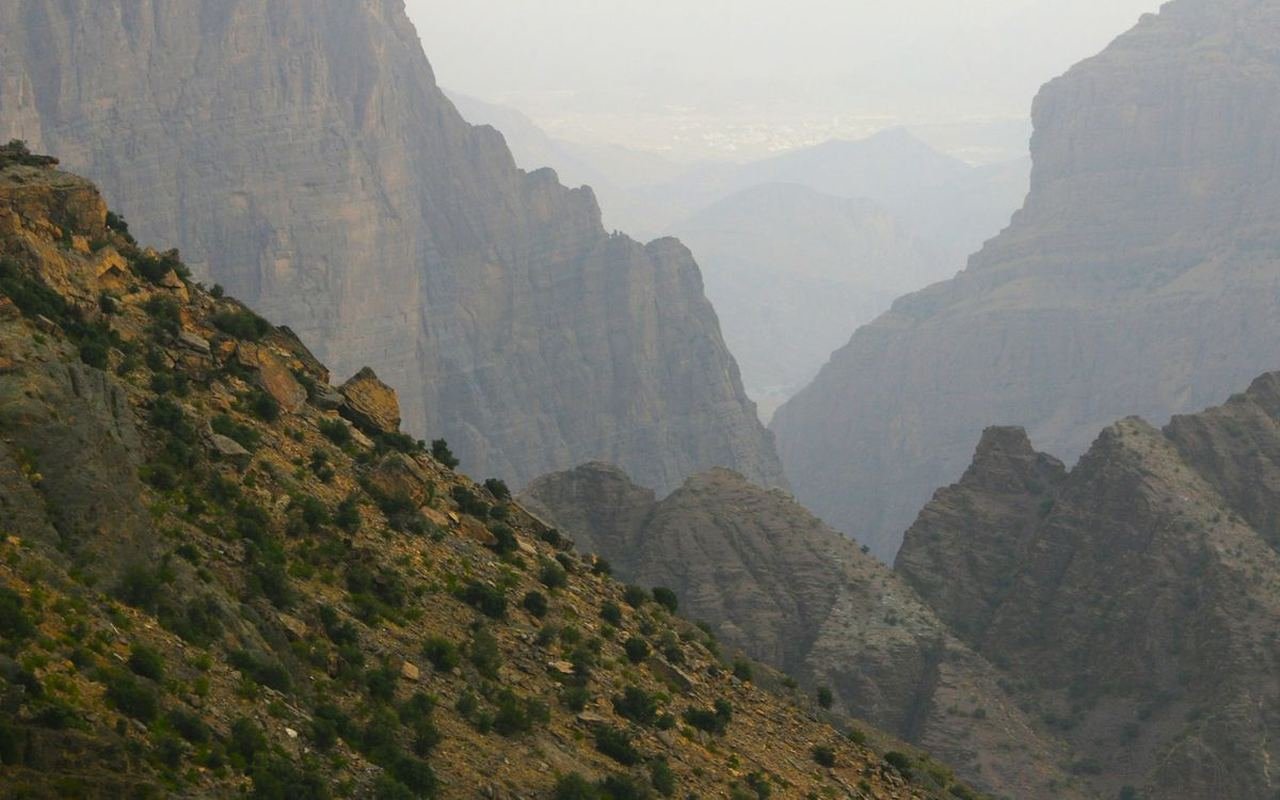 Green slope and canyon walls on Al Jabal Al Akhdar